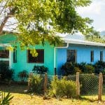 This jungle oasis has a fenced yard in addition to the other acreage.