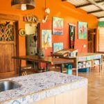Casa Jocote has kitchen that looks into the living room.