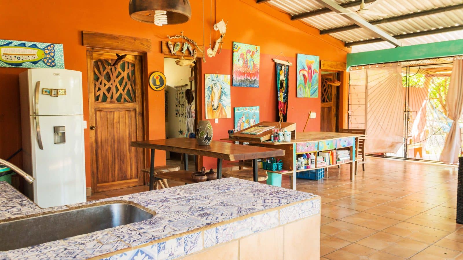 Casa Jocote has kitchen that looks into the living room.
