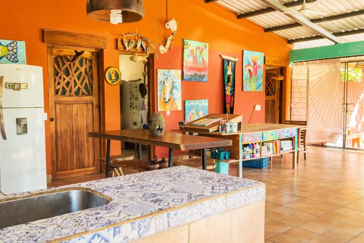 Casa Jocote has kitchen that looks into the living room.