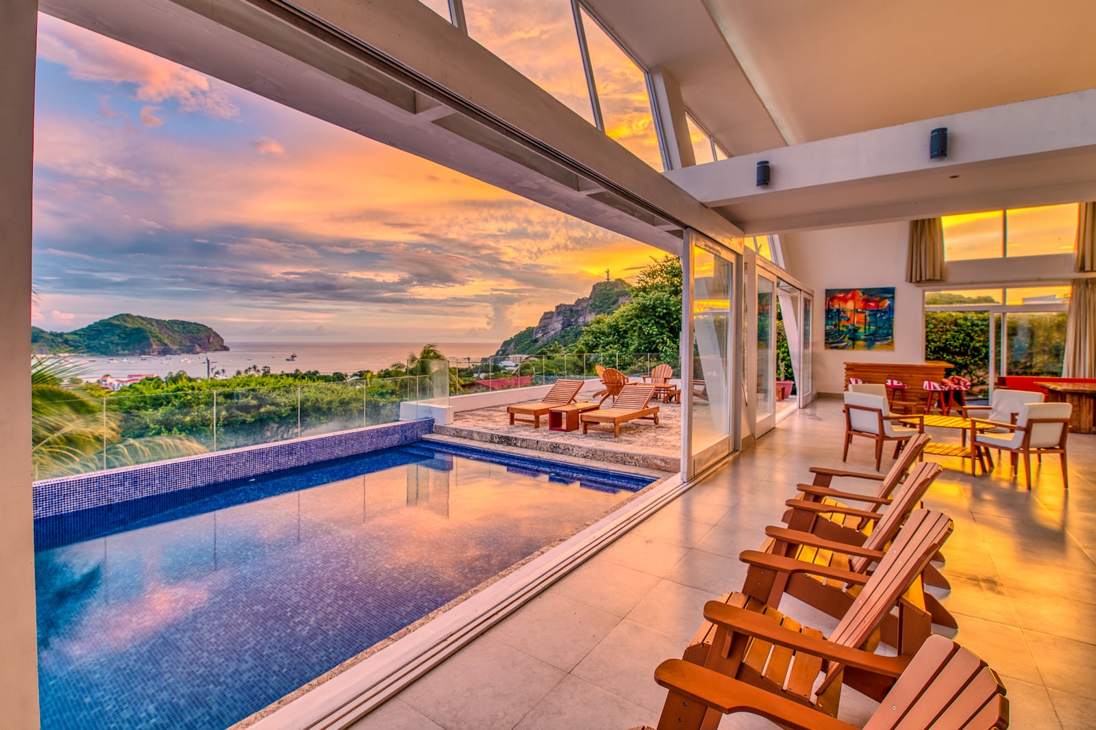 Sunset view of ocean from luxury home living room
