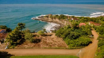 Surfer at Playa Rosada at Rancho Santana.