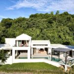 Aerial Photo of Villa Artista, modern home with large pool.