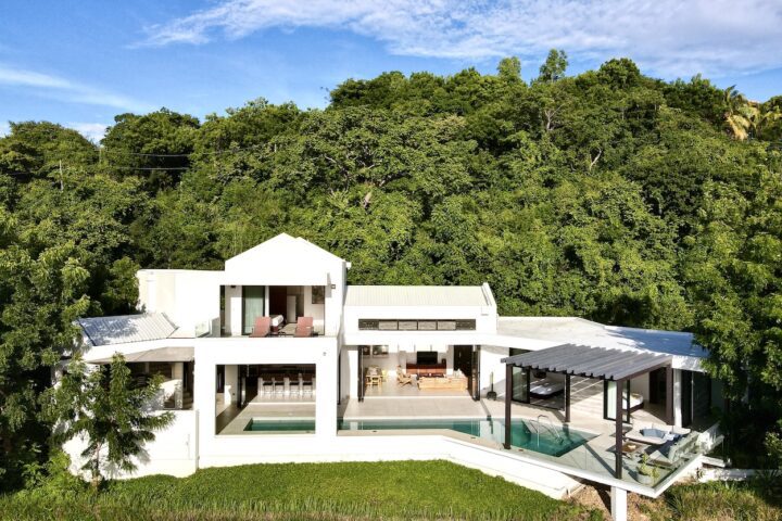 Aerial Photo of Villa Artista, modern home with large pool.