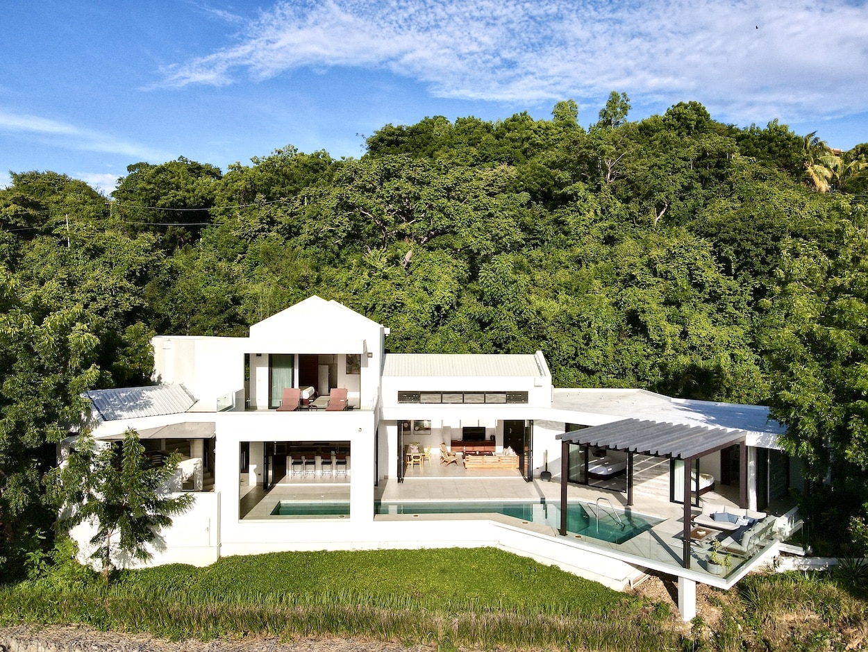Aerial Photo of Villa Artista, modern home with large pool.