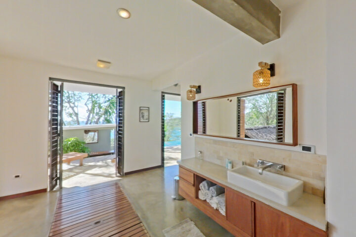 Bathroom sinks and glass door view