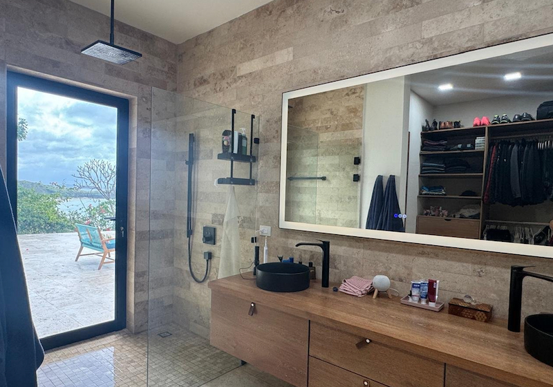 bathroom sinks with a glass door
