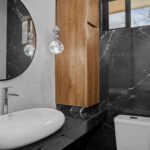 complete bathroom with mirror and sink in New Construction Near Playa Remanso