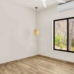 bedroom with air conditioning in New Construction Near Playa Remanso