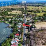 Aerial view of panamerican road, arrow marker, and wind turbines.