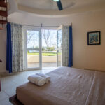bedroom with access to the pool in Playa Maderas Cliff-Front Estate