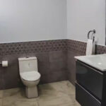 Upstairs half bath in the oceanview rental-ready condo