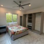 bedroom with ceiling fan in Turnkey Bay View Condo