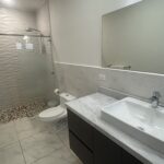 complete bathroom with mirror and sink