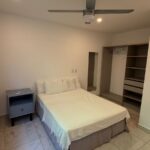 bedroom with a single bed and ceiling fan