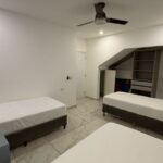 three singles bed bedroom with air conditioning and ceiling fan In Turnkey Bay View Condo