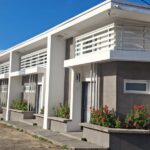 Front exterior of the boutique three-unit building