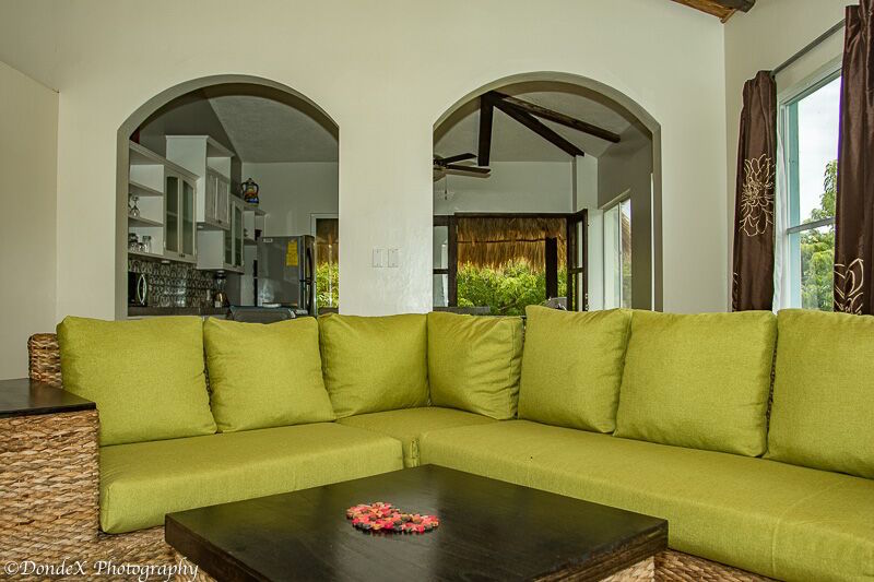 living room with sofas in Colonial Surf Retreat in Popoyo
