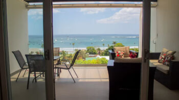 Living room opening to the patio and bay view