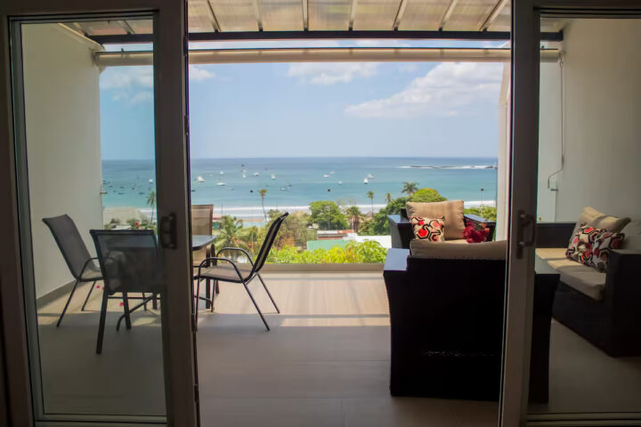 Living room opening to the patio and bay view