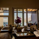 Dining area with afternoon light at the oceanview rental-ready condo