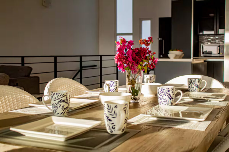 Open dining, kitchen, and stairwell