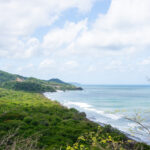 Coastal land with a road leading toward the beach