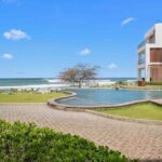 Luxury Beachfront Condo at Hacienda Iguana with an infinity pool above the Pacific