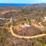 Large corner building lot in the gated El Encanto del Sur community