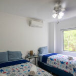 Bedroom in the modern apartment near the beach