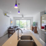 Kitchen in the modern apartment near the beach
