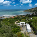 Drone view of the development and surrounding hills
