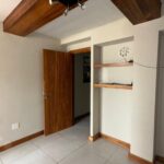 Porcelain tile and track lighting in the office