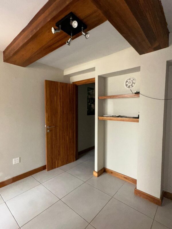Porcelain tile and track lighting in the office