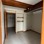 Compact kitchenette at the back of the unit