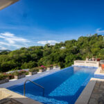 Infinity pool at the Pacific Marlin Estate looking out over the bay
