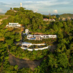 Aerial of the Pacific Marlin Estate on the hillside above the coastline