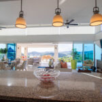 Open-plan kitchen and living area at the Pacific Marlin Estate with a granite island