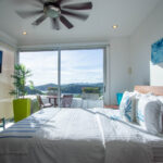Bedroom at the Pacific Marlin Estate with sweeping bay views