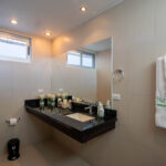 Full bathroom with a vanity and a walk-in shower