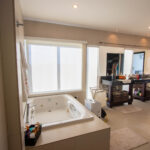 En-suite bathroom with a soaking tub and a bay view