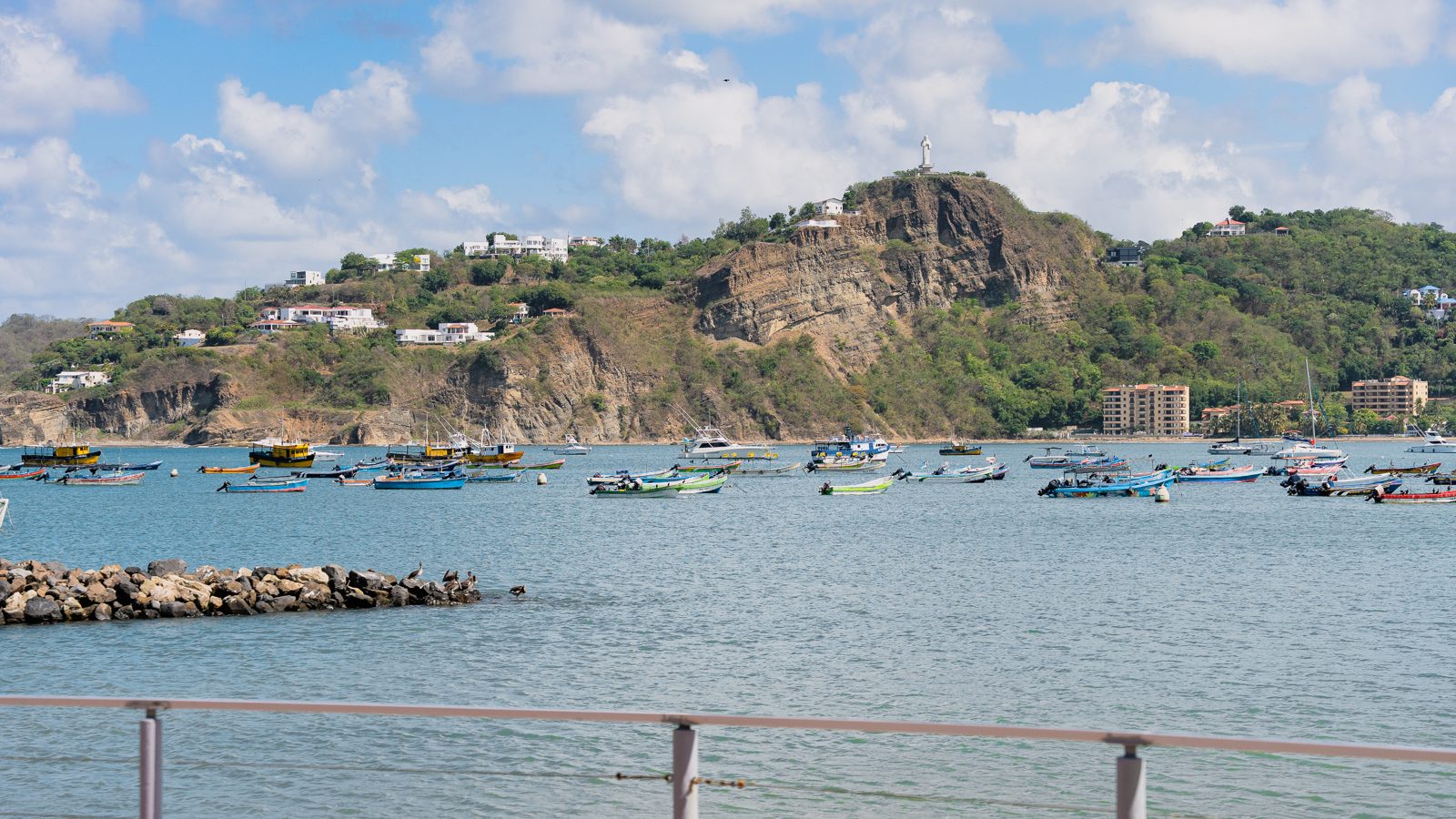 Panorama of San Juan del Sur bay with anchored boats and the town beyond