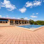 153 acre lakeview farm in Rivas — main house with swimming pool