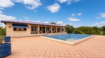 153 acre lakeview farm in Rivas — main house with swimming pool
