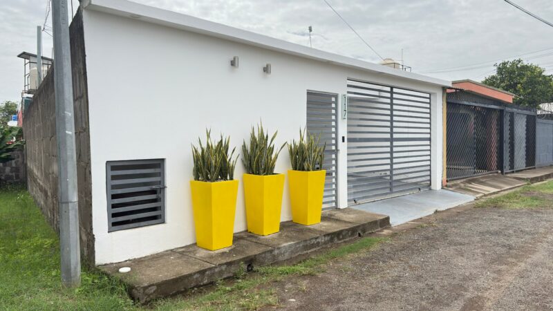 Affordable home near San Juan del Sur in Puertas del Sol, Rivas — front exterior with garage
