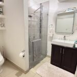 Half bath with vanity and shelving