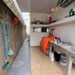 Side passage with laundry and storage