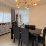 Dining area with a modern chandelier