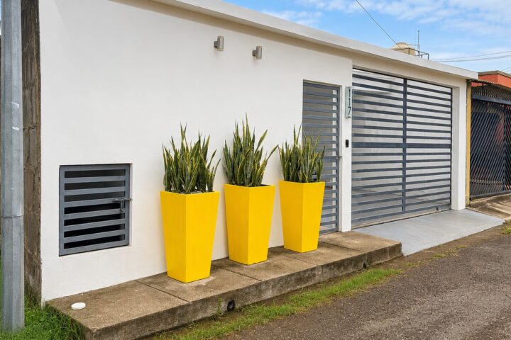 Affordable home near San Juan del Sur in Puertas del Sol, Rivas — front exterior with garage