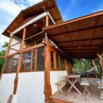Exterior of the wood-and-glass jungle home in Escamequita